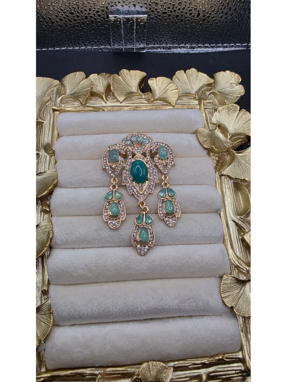 Vintage-Inspired Teal Gemstone Brooch with Dangling Design